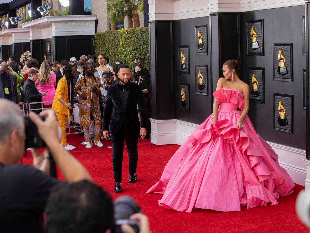 John Legend, top/left, and wife Chrissy Teigen on the red carpet before the start of the 2022 G ...