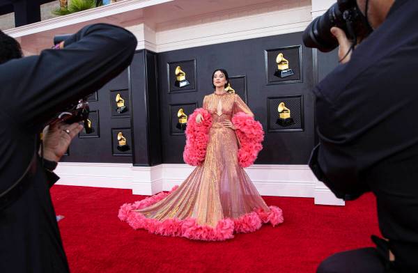St. Vincent, middle, on the red carpet before the start of the 2022 Grammy Awards on Sunday, Ap ...