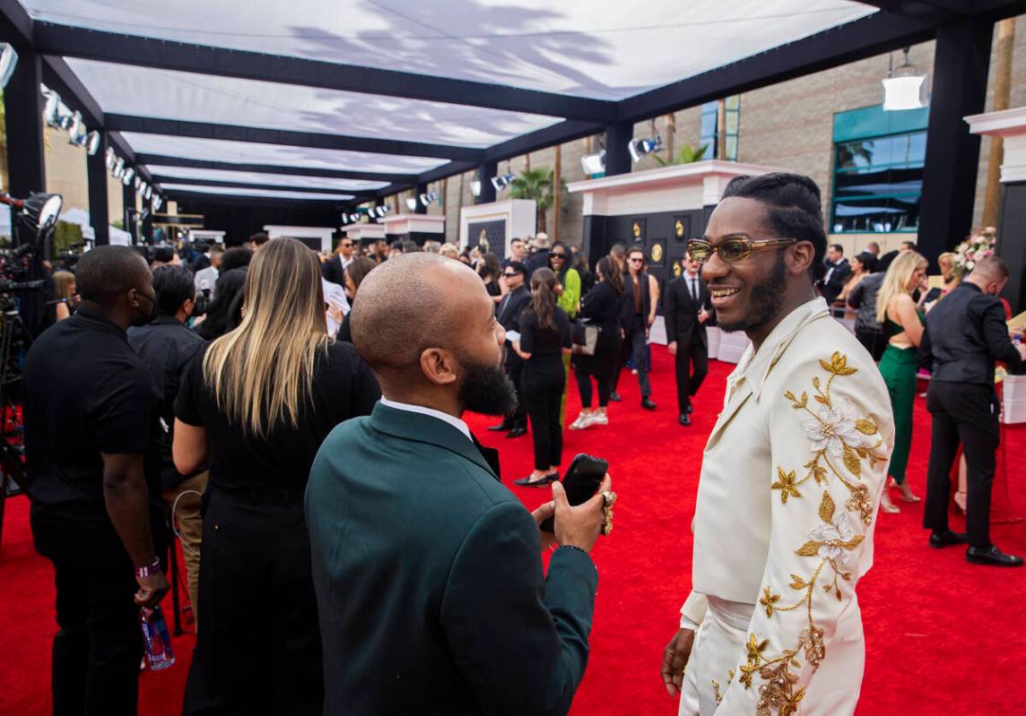 Leon Bridges, right, on the red carpet before the start of the 2022 Grammy Awards on Sunday, Ap ...