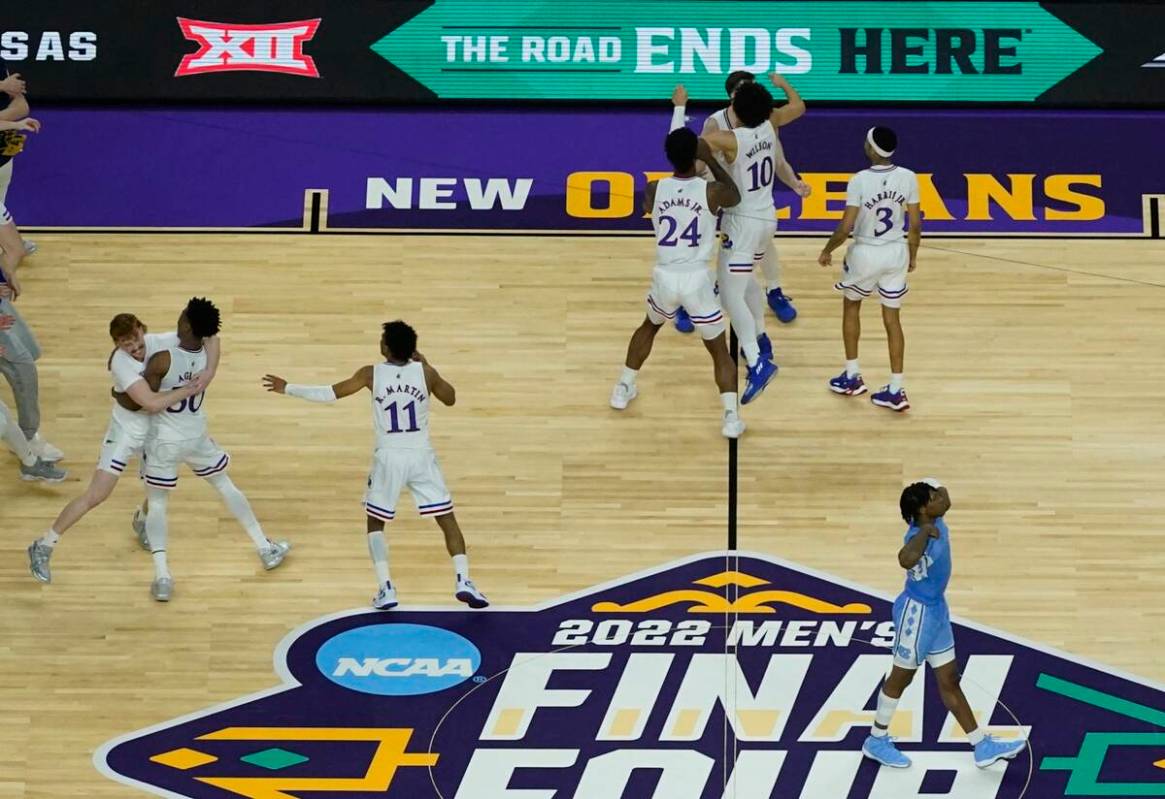 Kansas players celebrate after a college basketball game against North Carolina in the finals o ...