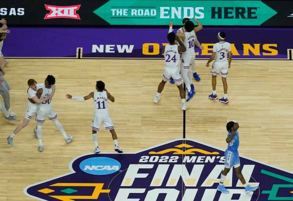 Kansas players celebrate after a college basketball game against North Carolina in the finals o ...