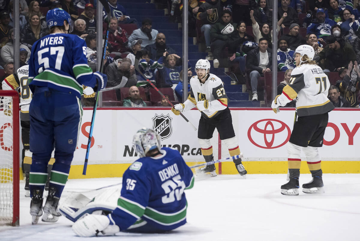 Vegas Golden Knights' Shea Theodore (27) and William Karlsson (71) celebrate after Theodore sco ...