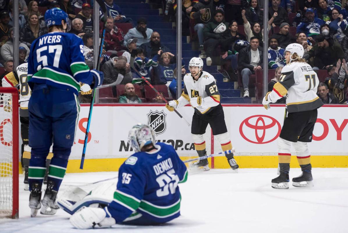 Vegas Golden Knights' Shea Theodore (27) and William Karlsson (71) celebrate after Theodore sco ...