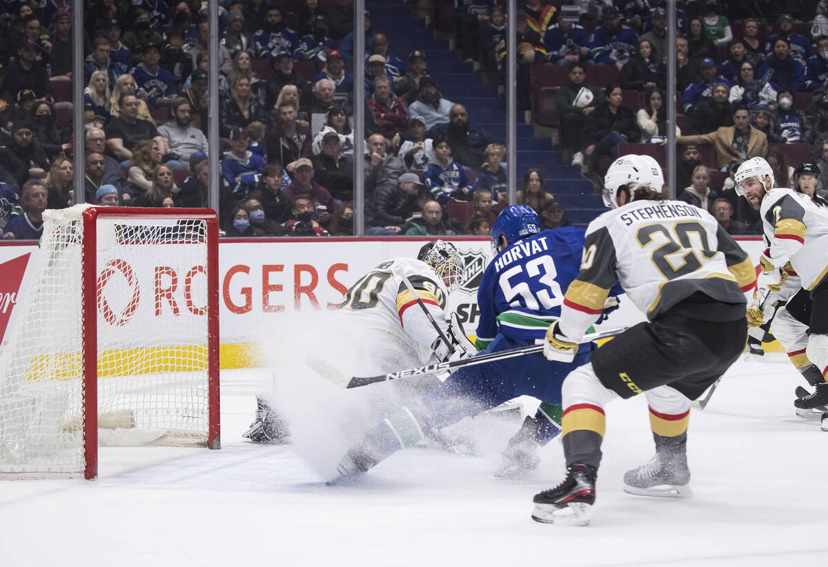 Vegas Golden Knights goalie Robin Lehner (90), of Sweden, stops Vancouver Canucks' Bo Horvat (5 ...