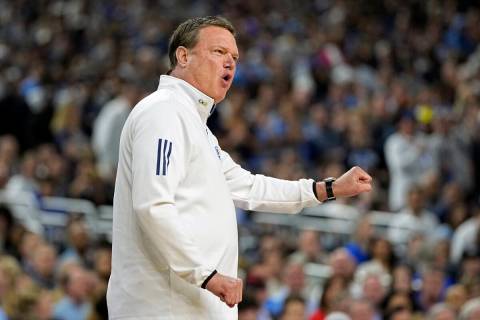 Kansas head coach Bill Self directs his players during the first half of a college basketball g ...