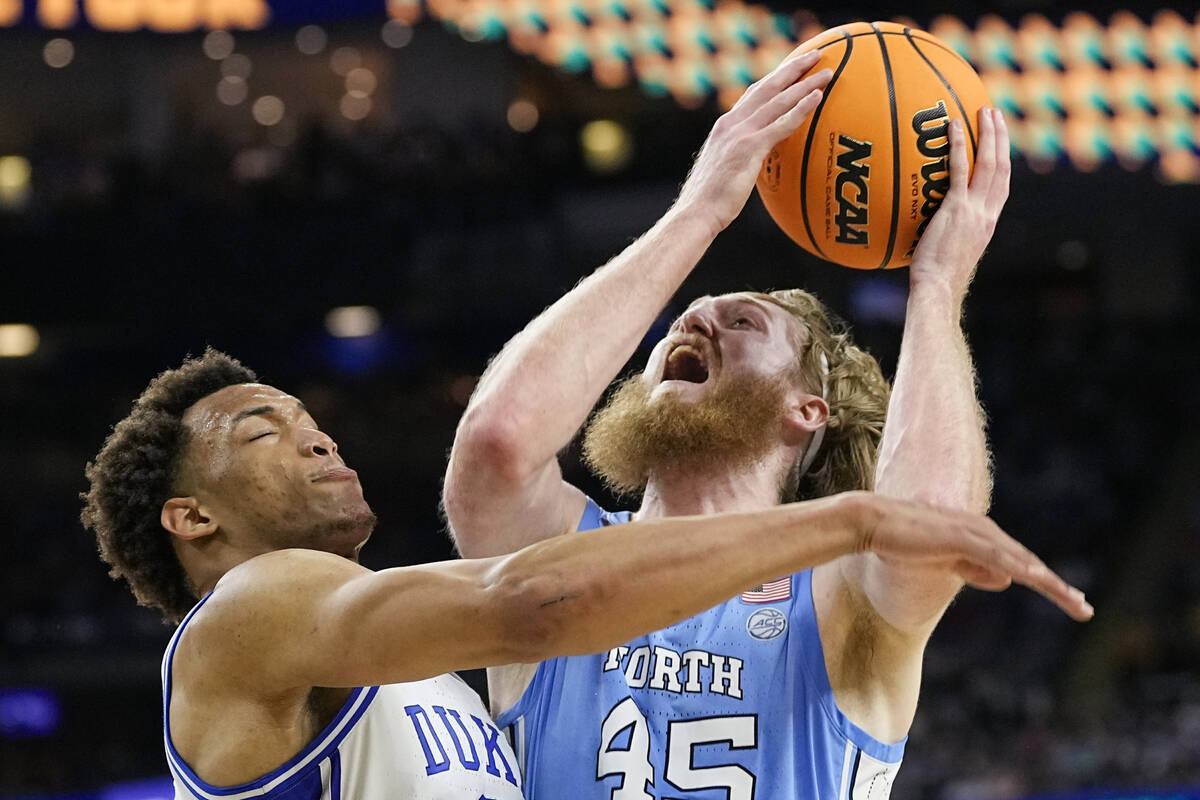 North Carolina forward Brady Manek (45) shoots over Duke forward Wendell Moore Jr. during the f ...