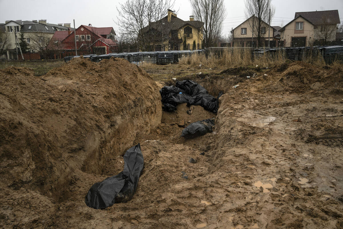 A mass grave in Bucha, on the outskirts of Kyiv, Ukraine, Sunday, April 3, 2022. Ukrainian troo ...