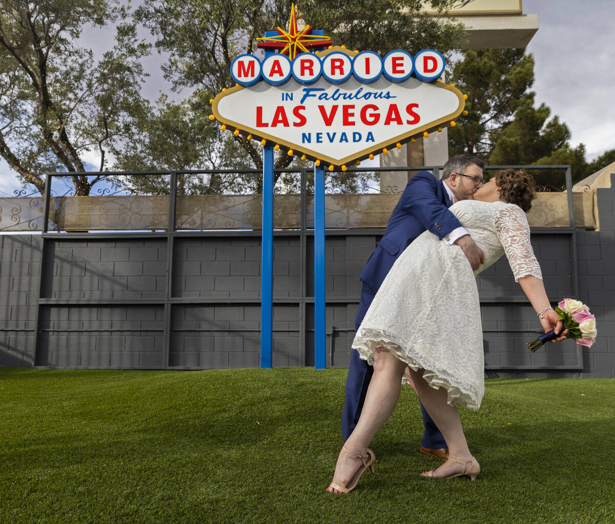 Bryan and Amy McGillis, from Vancouver, Wash., pose for a photo in front of the wedding-inspire ...