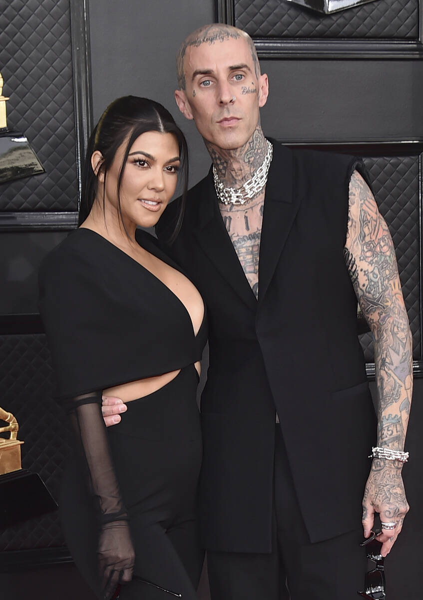 Kourtney Kardashian, left, and Travis Barker appear at the 64th Annual Grammy Awards in Las Veg ...