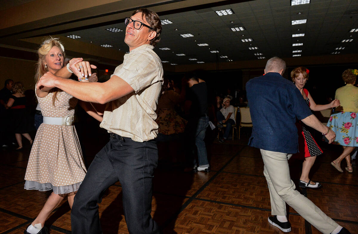 Linda Lou, left, and Jay Greaves from Canada dance to live music at The Orleans during the Viva ...