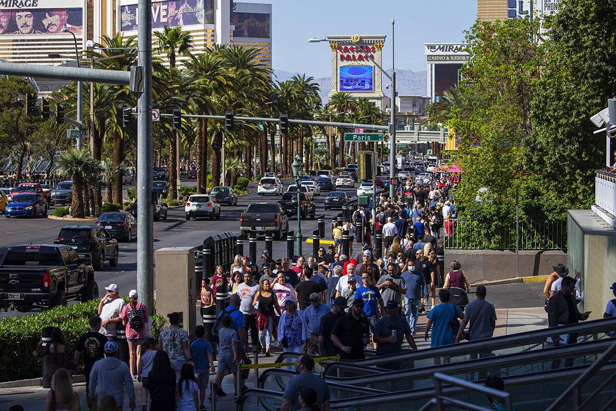 Pedestrians crowd the Las Vegas Strip on Wednesday, April 6, 2022, outside of the Miracle Mile ...