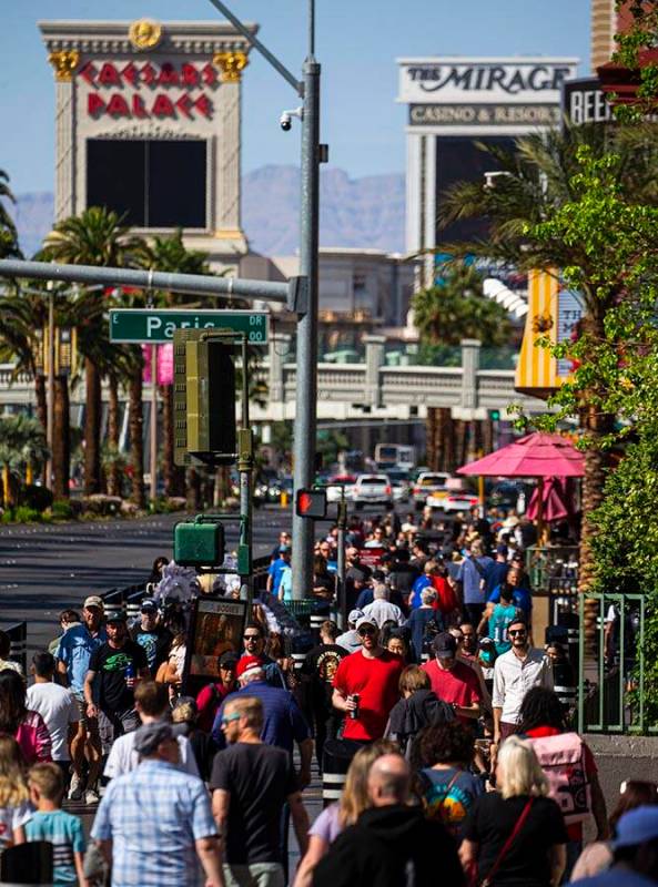 Pedestrians crowd the Las Vegas Strip on Wednesday, April 6, 2022, outside of the Miracle Mile ...