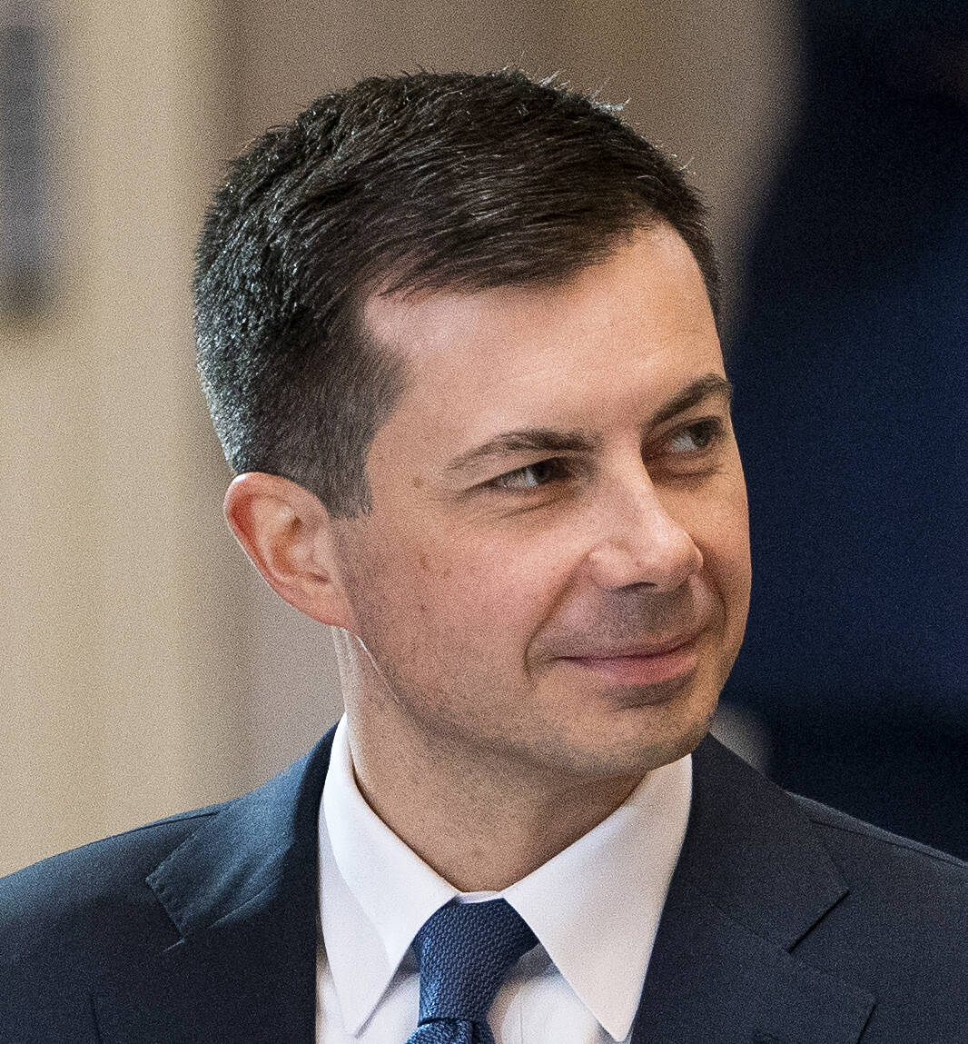 Secretary of Transportation Pete Buttigieg is seen during a ceremony as Rep. Don Young, R-Alask ...