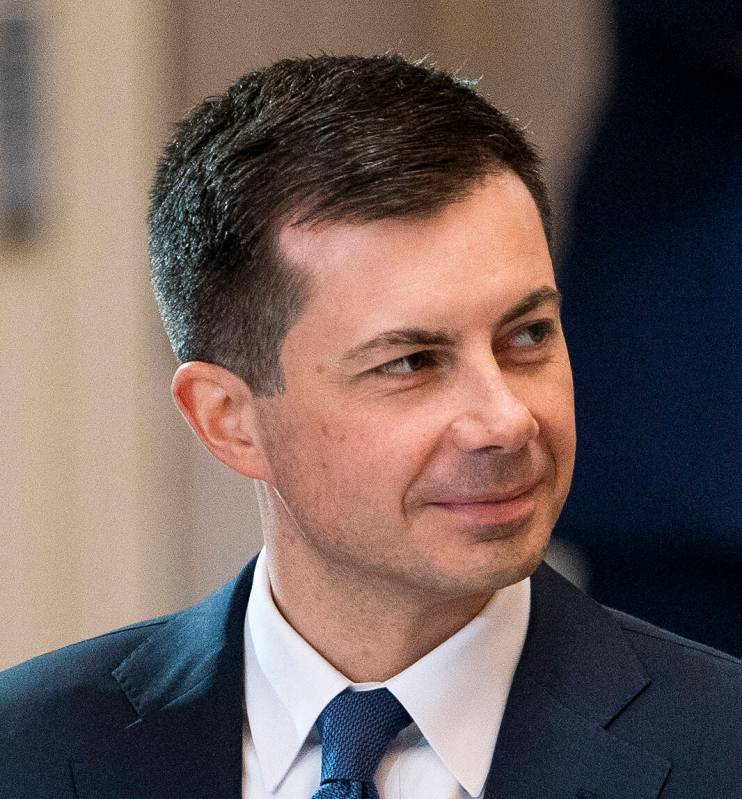 Secretary of Transportation Pete Buttigieg is seen during a ceremony as Rep. Don Young, R-Alask ...