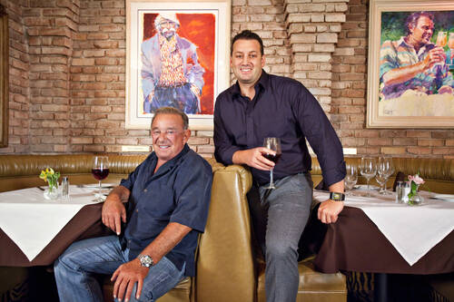Freddie, left, and Evan Glusman relax in their restaurant, Piero’s Italian Cuisine in Septemb ...