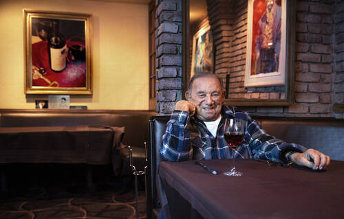 Piero's owner Freddie Glusman in 2020 at the booth in his restaurant which featured a scene wit ...