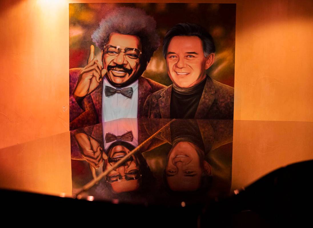 A painting hangs above the piano in the Monkey Bar at Piero's Italian Cuisine on Thursday, Apri ...