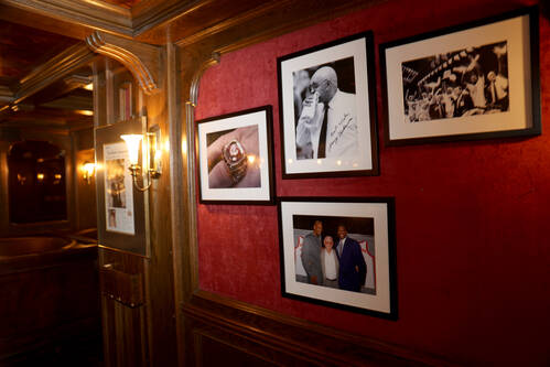 Photographs of former UNLV basketball coach Jerry Tarkanian decorate the wall at Piero's Italia ...