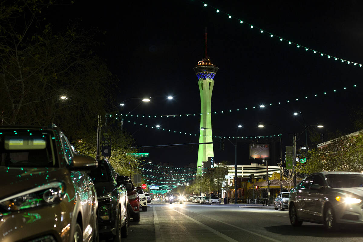 The Strat is lit green for St. Patrick's Day as seen from Main Street in the Arts District on W ...