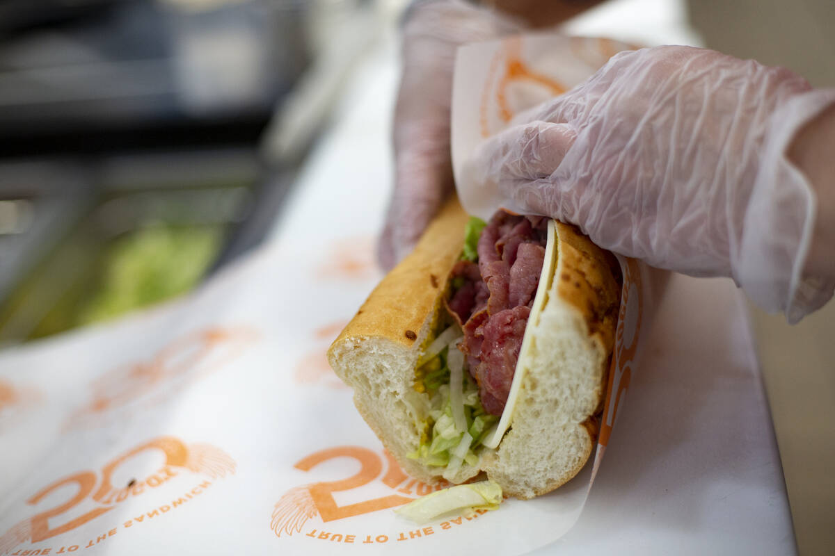 Employee Vanessa Naranjo wraps a pastrami sandwich at the Togo’s sandwich shop in Southe ...