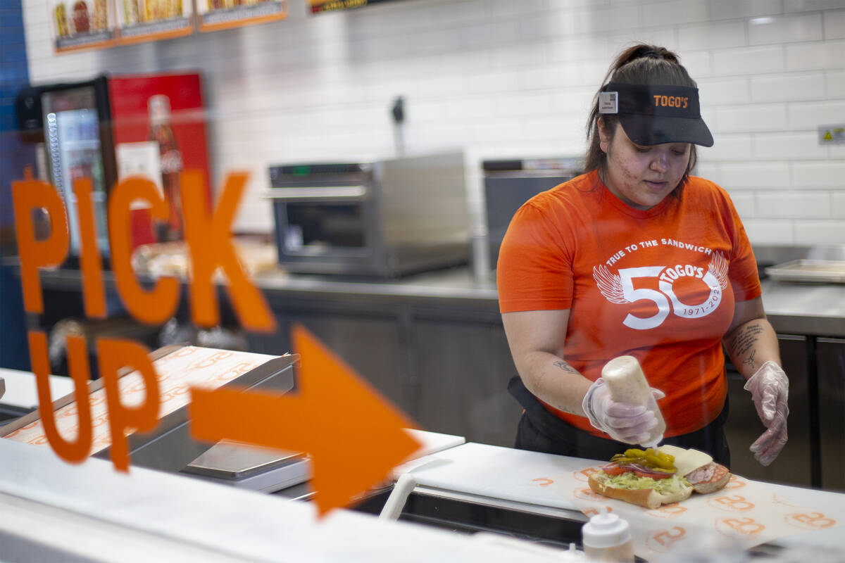 Employee Vanessa Naranjo crafts a sandwich at the Togo’s sandwich shop in Southern Highl ...