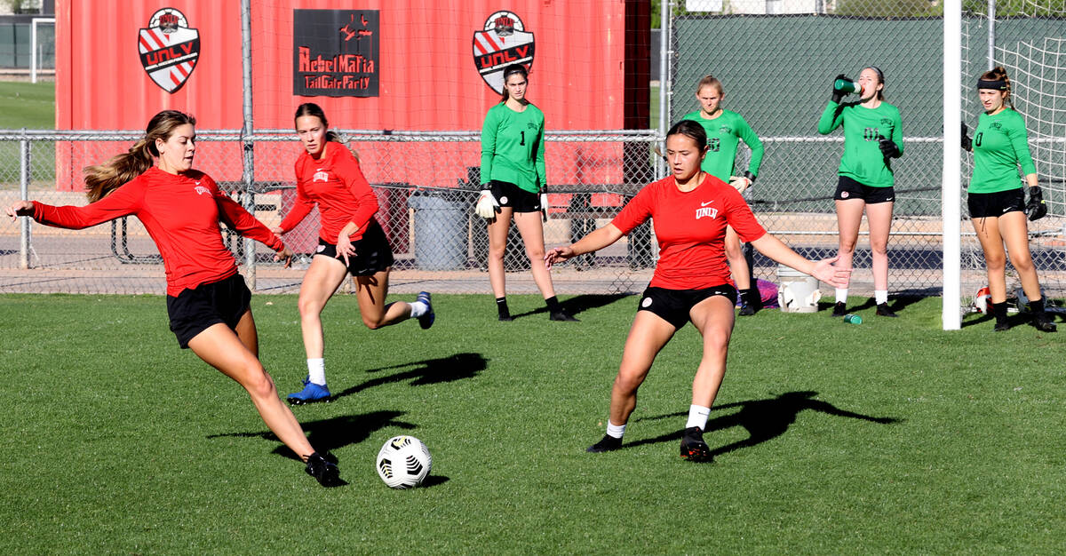 Forward Alysa Caso, from left, defender Heather Mitchell and midfielder Haley Halbersma during ...