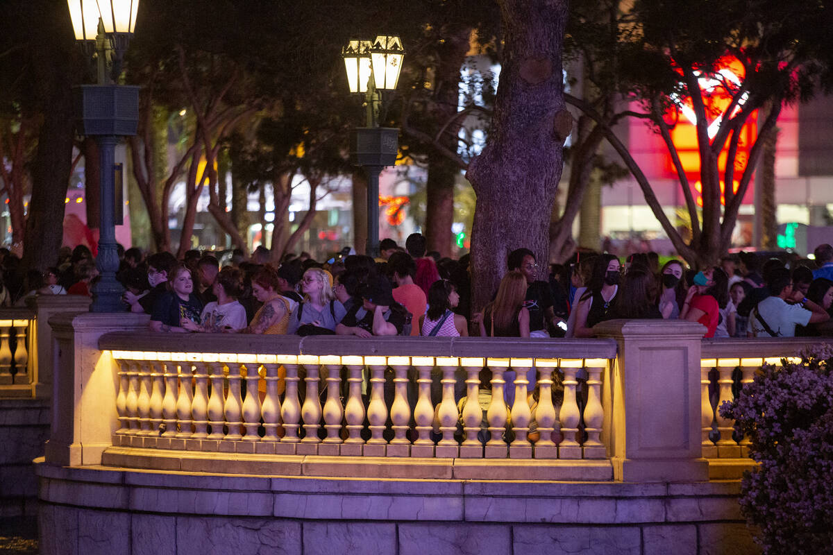 A crowd forms at Bellagio Fountain before the show features songs “Butter” and &# ...