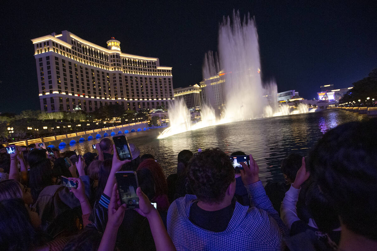 BTS fans line up as the Bellagio Fountain plays a show to songs “Butter” and &#x2 ...