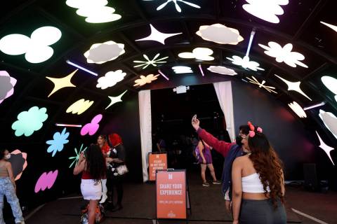 BTS fans enter a free BTS Pop-up at Area15 in Las Vegas Friday, April 8, 2022, ahead of the fir ...