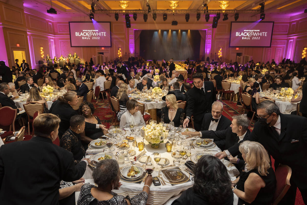 Guests are served dinner during Nevada Ballet Theatre’s 38th Annual Black & White Ba ...