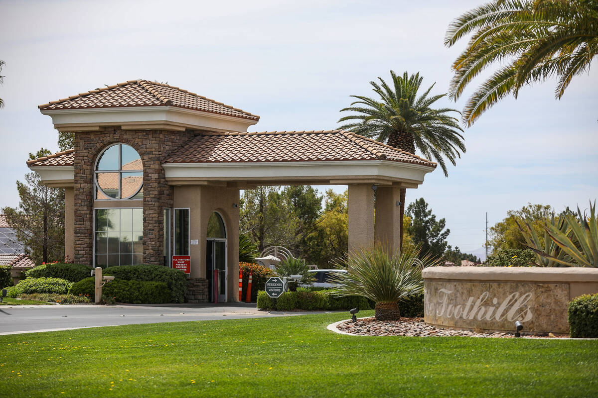 The entrance to a gated community where an armed teen was shot by a person walking their dog du ...