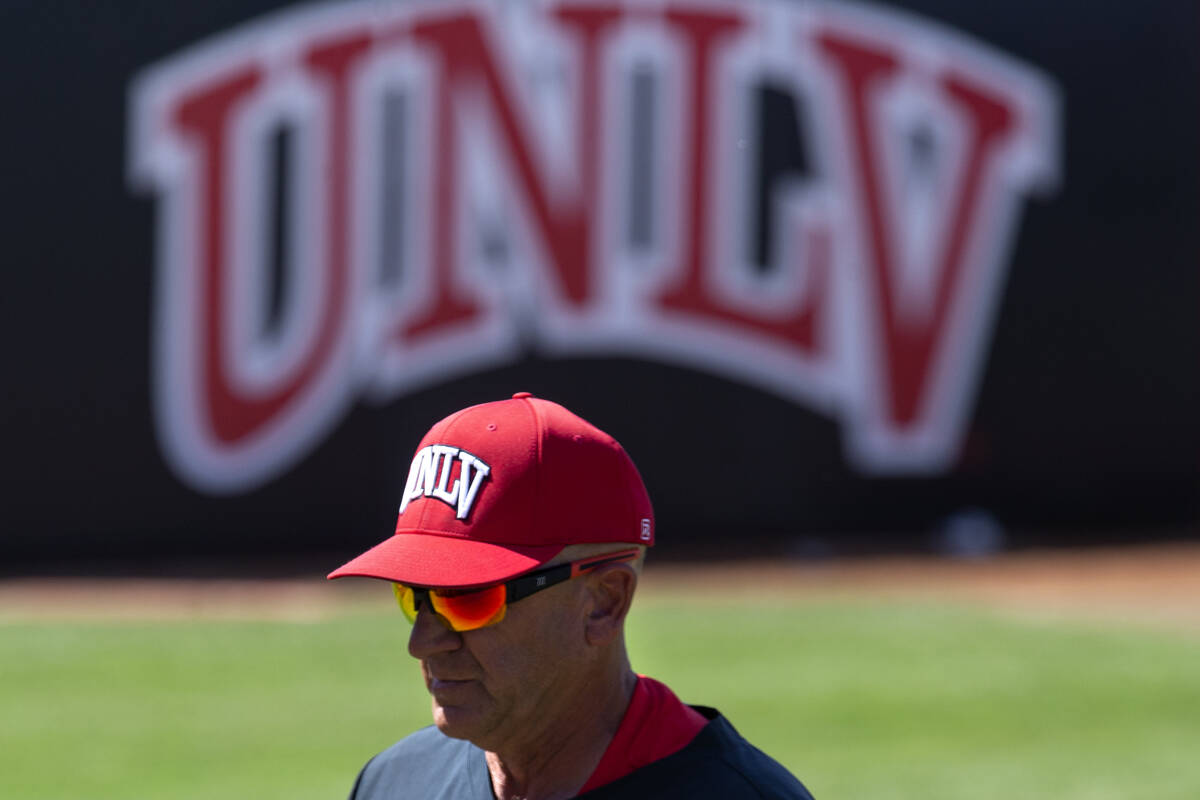 UNLV head coach Stan Stolte walks in from a time out during an NCAA baseball game against UNR a ...