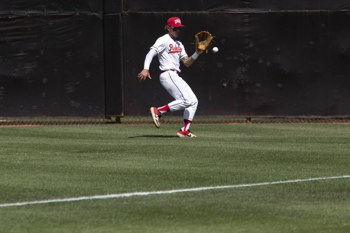 UNLV outfielder Joey Walls (9) reaches to catch during an NCAA baseball game against UNR at Ear ...