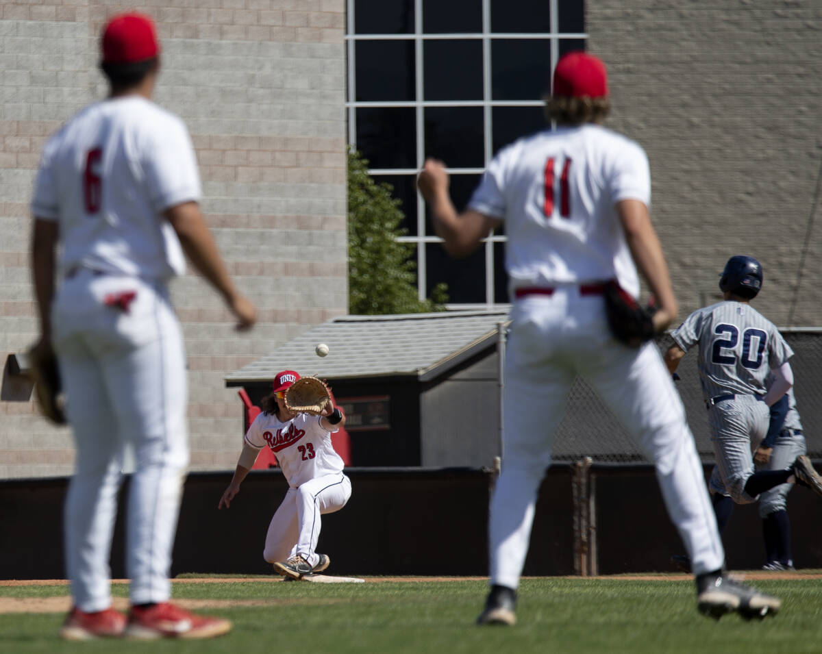 UNLV infielder Henry Zeisler (23) anticipates a catch to make the out against UNR outfielder An ...