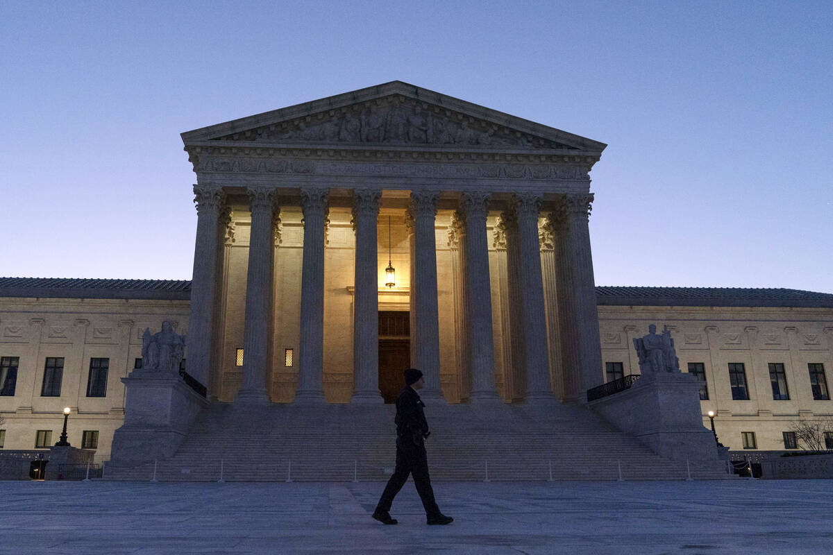 The U. S. Supreme Court is seen on a sunrise on Capitol Hill, in Washington, Monday, March 21, ...