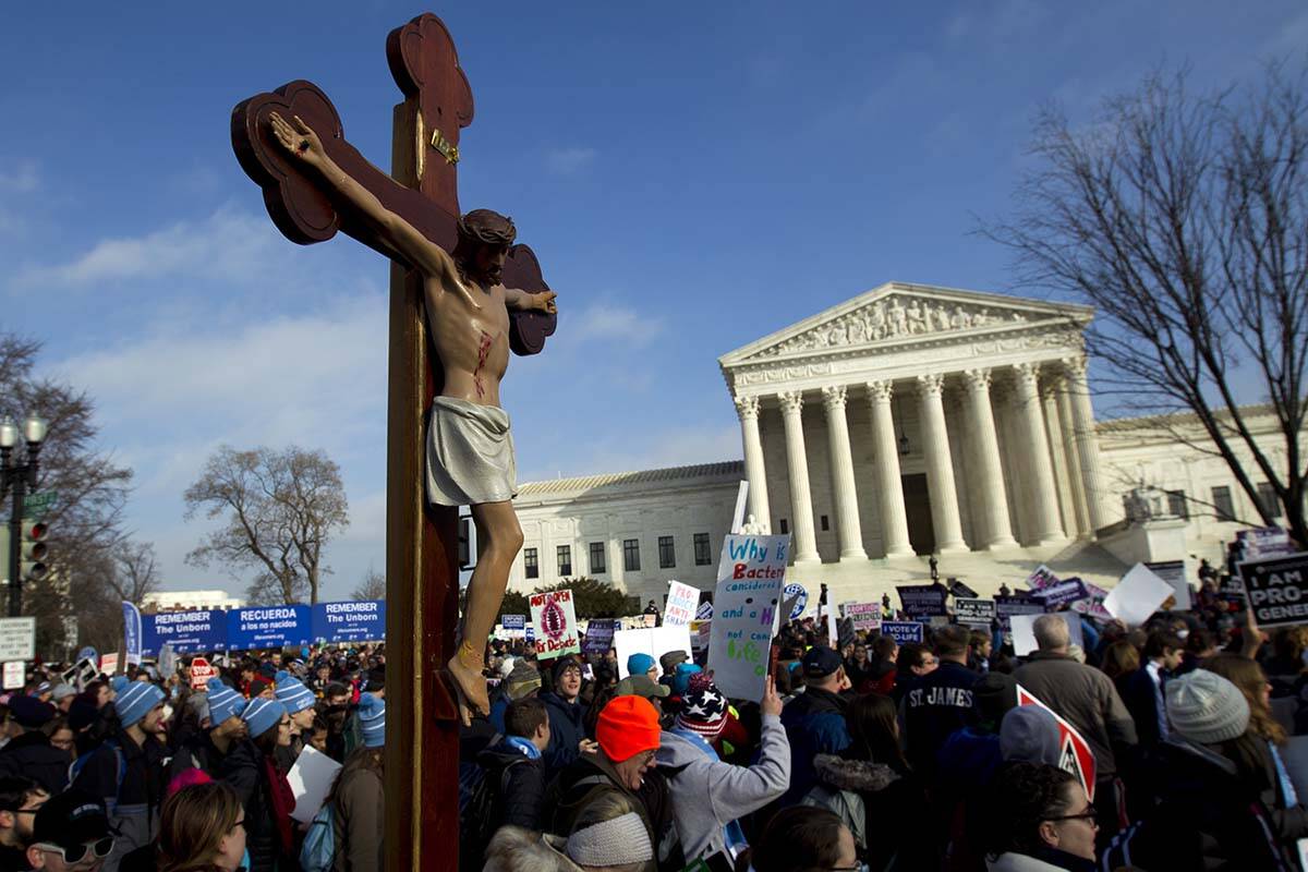 FILE - In this Friday, Jan. 18, 2019 file photo, anti-abortion activists march outside the U.S. ...