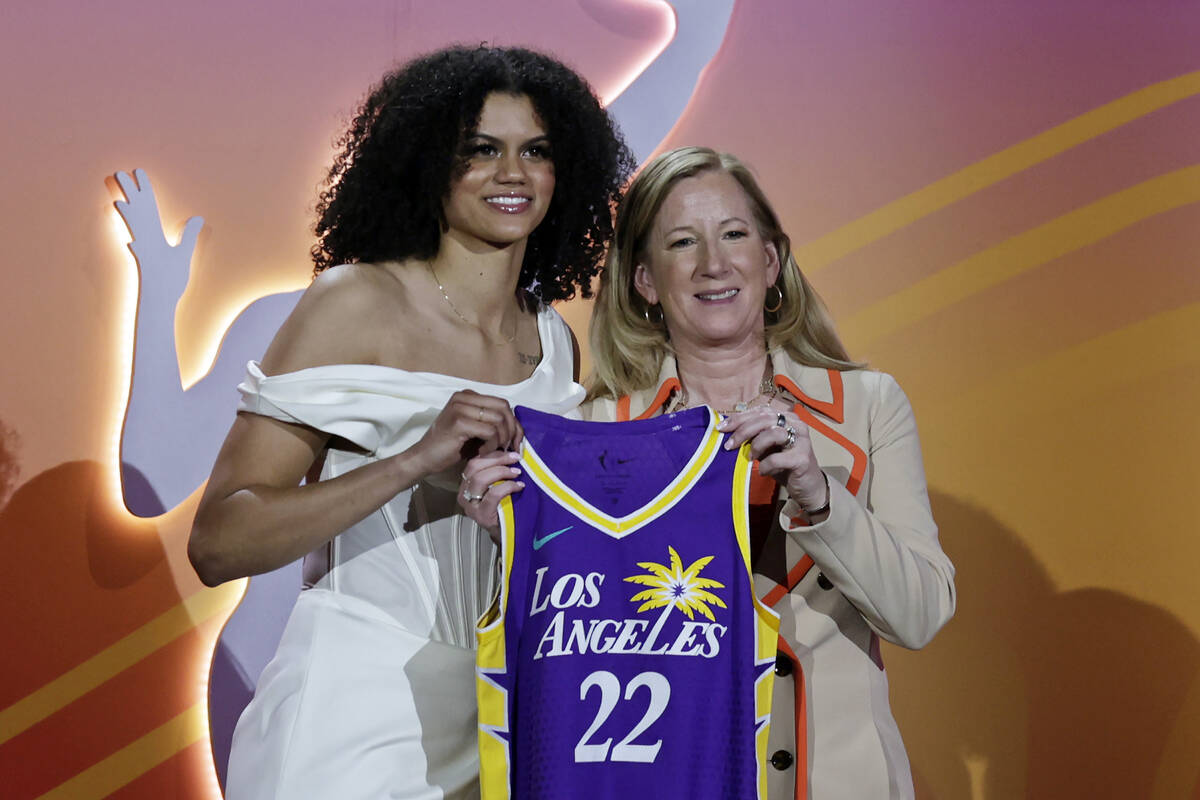 Tennessee's Rae Burrell, left, poses for a photo with commissioner Cathy Engelbert after being ...