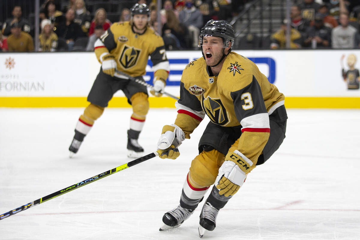 Golden Knights defenseman Brayden McNabb (3) falls to the ice in pain during the second period ...
