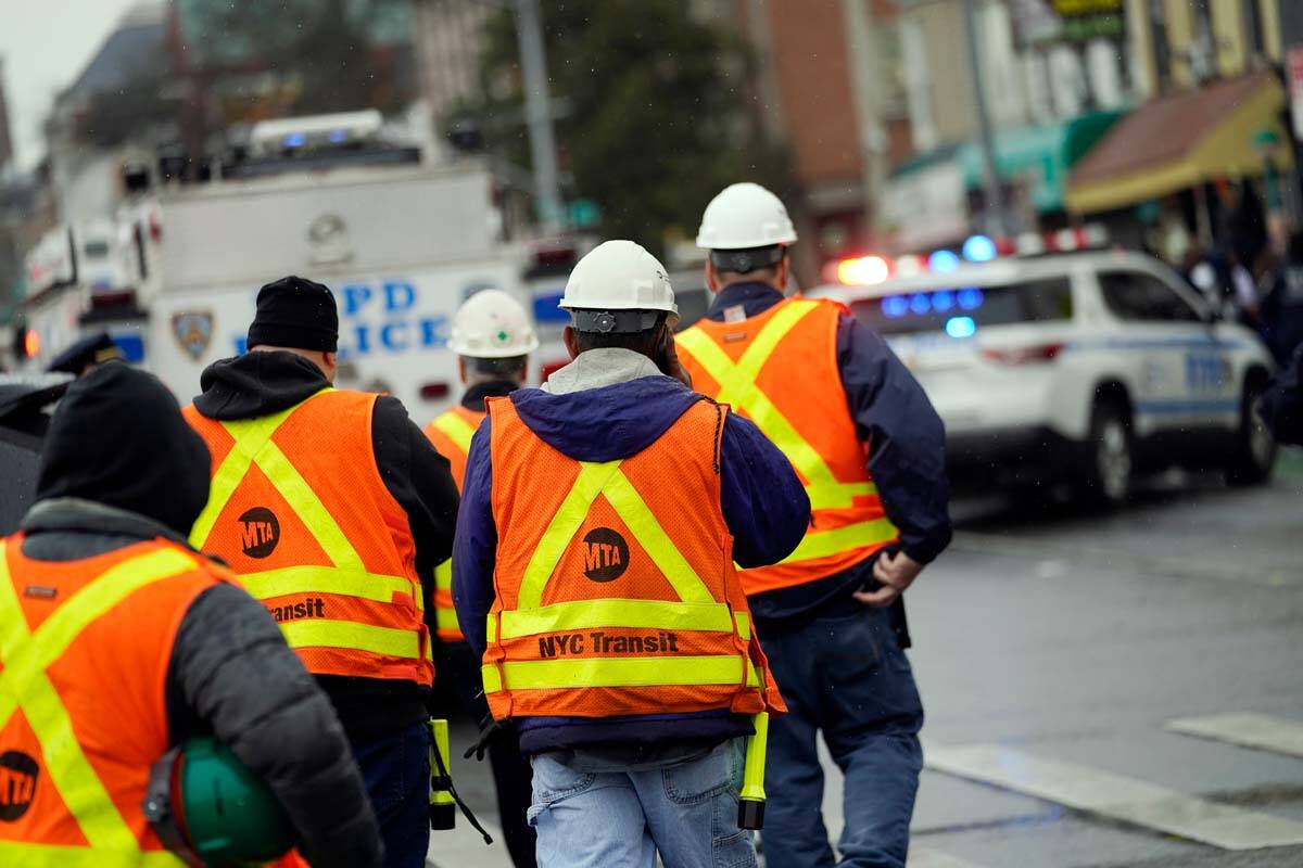 New York City Transit workers arrive at subway stop in the Brooklyn borough of New York, Tuesda ...