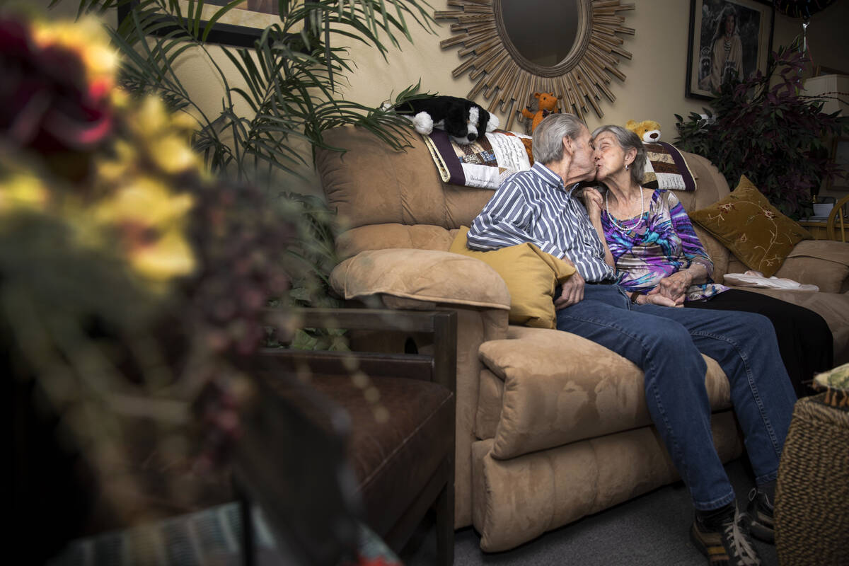 Jimmie Joe Monroe, 88, left, and his wife Florrine Enns, 85, pose for a phot at their Henderson ...