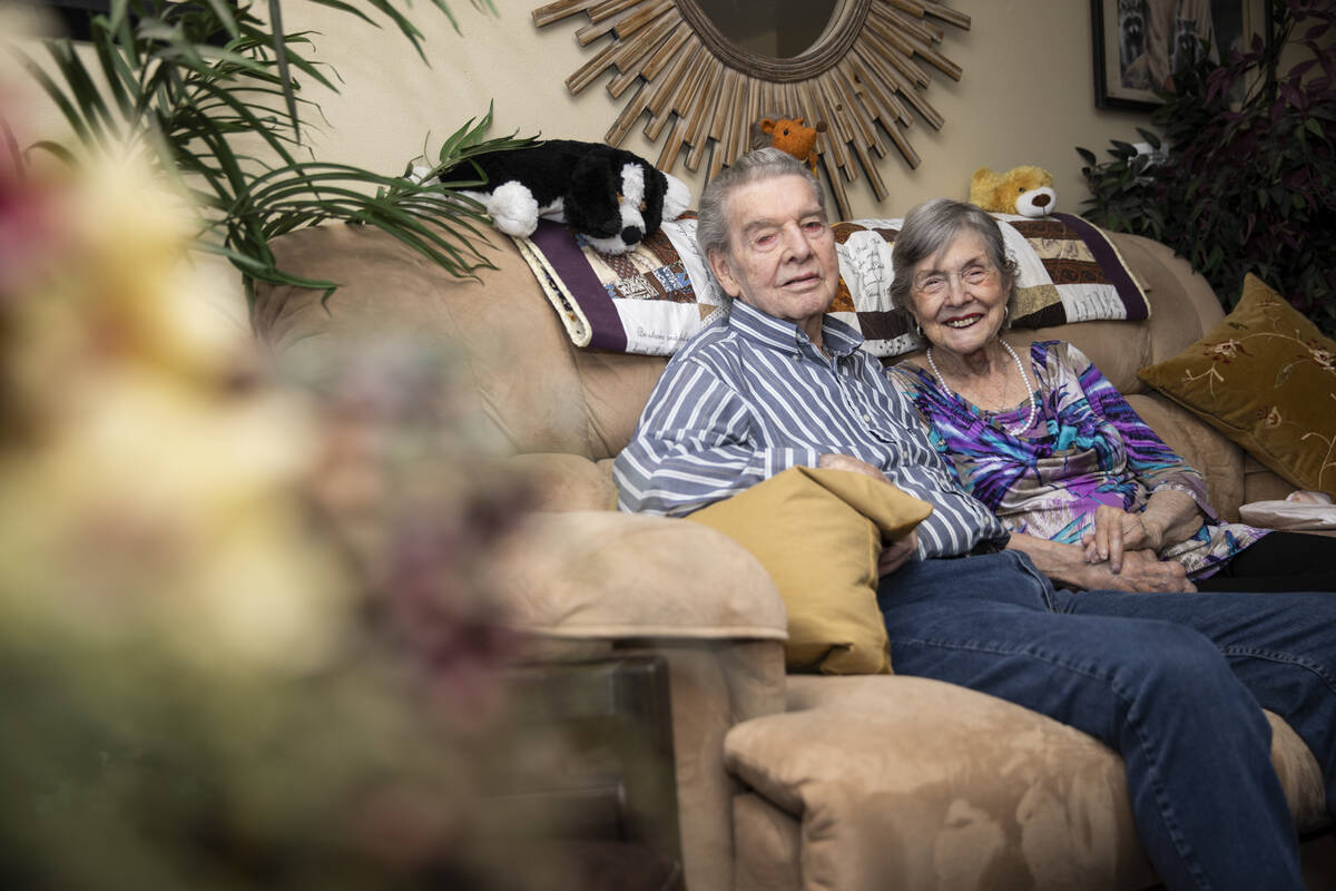 Jimmie Joe Monroe, 88, left, and his wife Florrine Enns, 85, pose for a phot at their Henderson ...