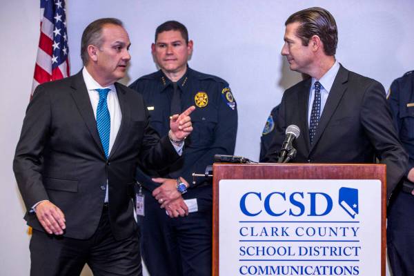 Clark County School District Superintendent Dr. Jesus F. Jara, left, steps in as Chief College, ...