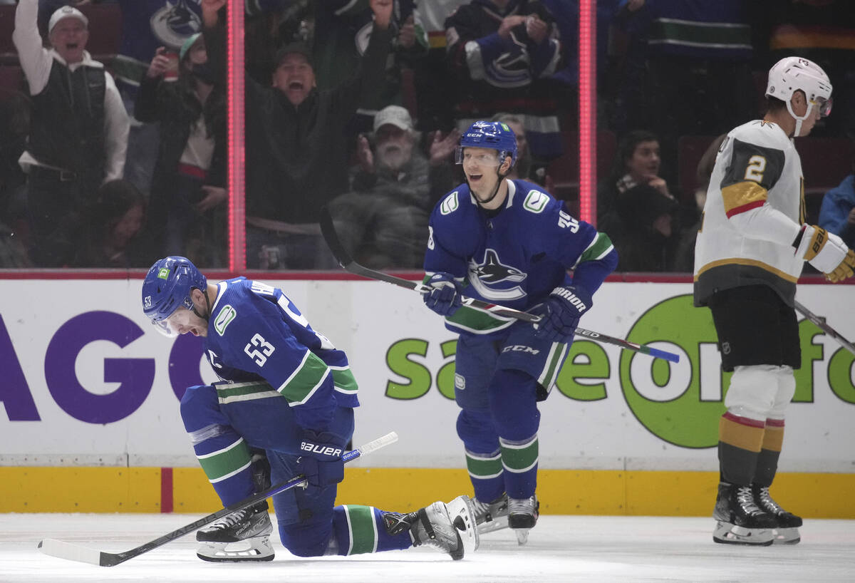 Vancouver Canucks' Bo Horvat (53) and Alex Chiasson (39) celebrate Horvat's goal, as Vegas Gold ...