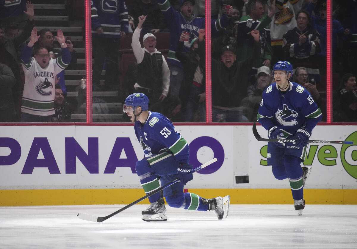 Vancouver Canucks' Bo Horvat (53) and Alex Chiasson (39) celebrate Horvat's goal against the Ve ...