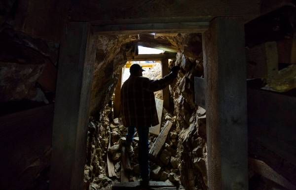 Caden Gould of Genoa searches through an old mine in search of vintage denim and other antiquit ...