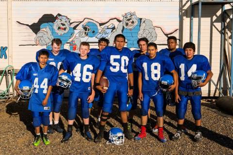 Members of the McDermitt High School football team pose for a photo in McDermitt in September 2 ...