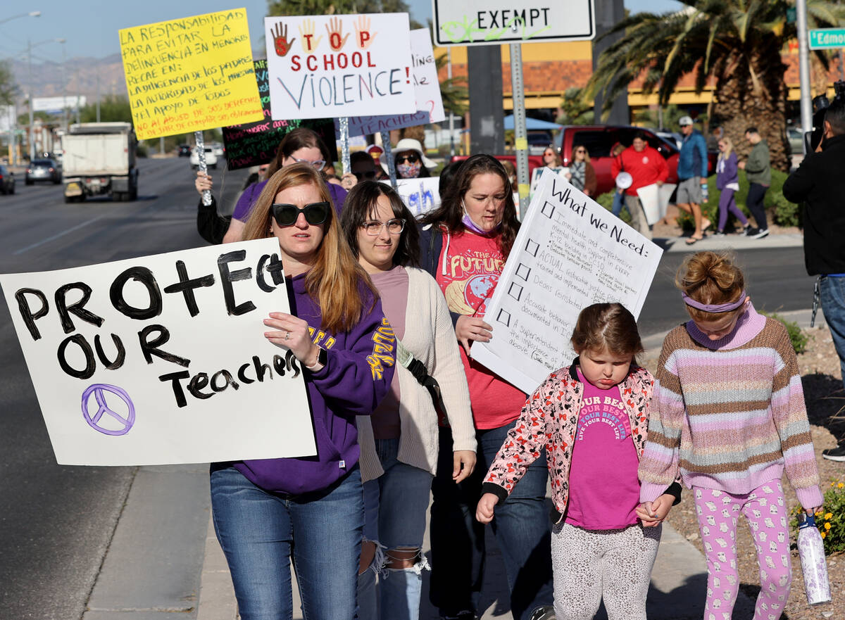 Erin Dressler, left, and her daughters Natalie, 5, and Allison, 9, protest school violence in s ...