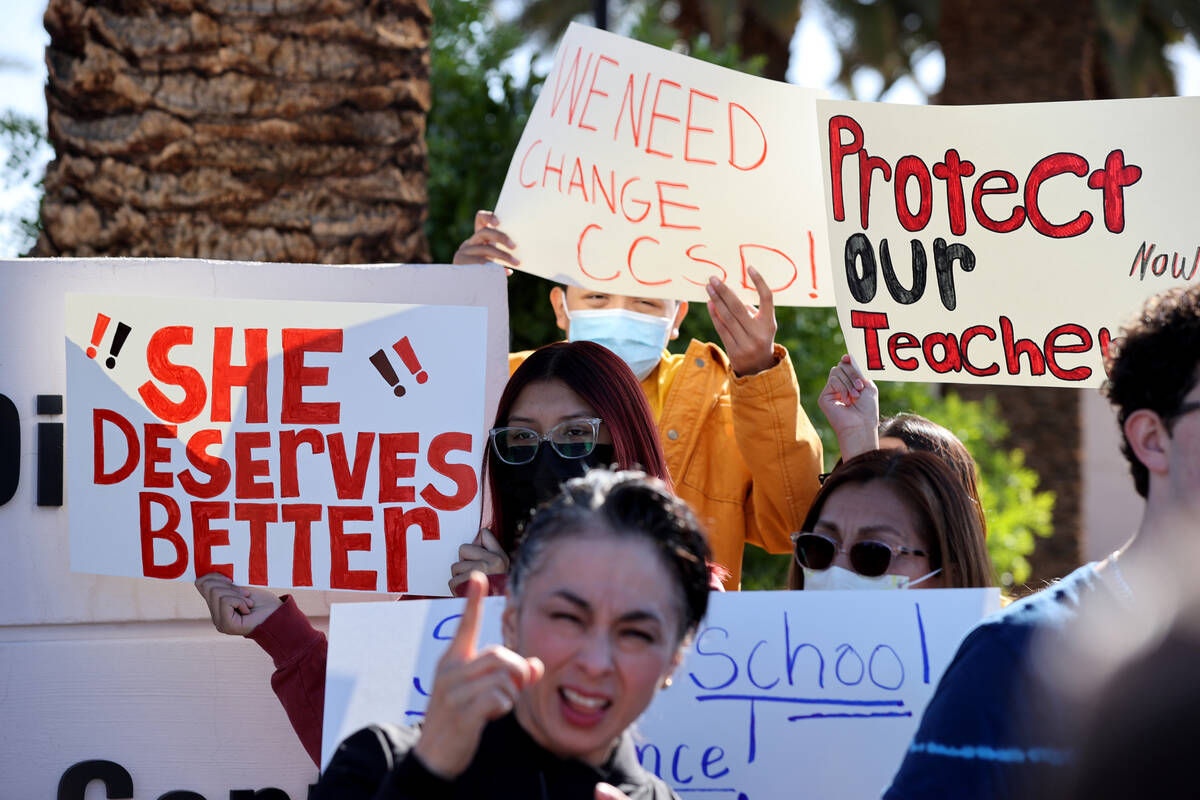 Parents, teachers and students protest violence in schools during a demonstration outside Clark ...