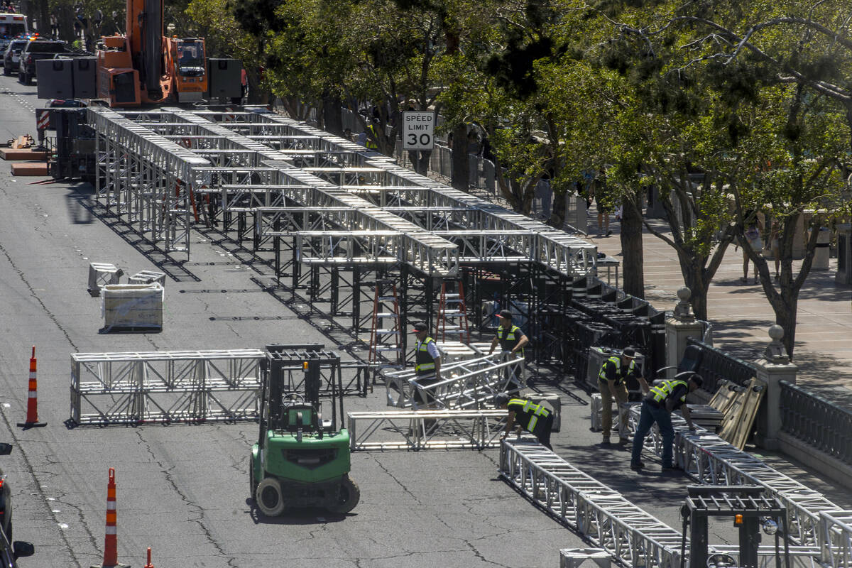 Construction workers assemble metal sections as work has started on the NFL red carpet draft st ...
