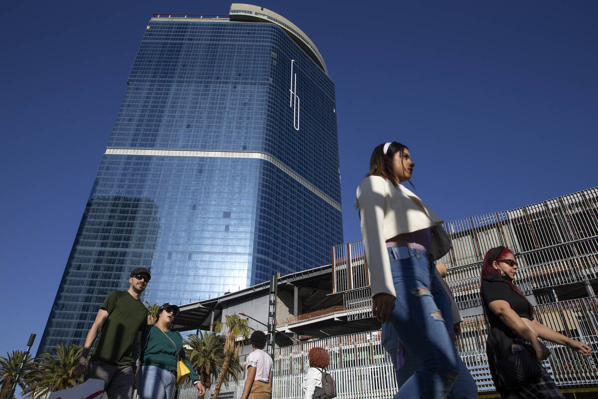 Pedestrians walk on Las Vegas Boulevard past Fontainebleau Las Vegas on Wednesday, April 13, 20 ...